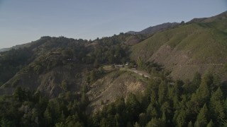 5K aerial stock footage of flying over hills, approaching Highway 1, Big Sur, California Aerial Stock Footage | AXSF03_101