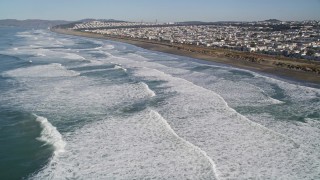 5K aerial stock footage fly over waves rolling into the Outer Sunset District community, San Francisco, California Aerial Stock Footage | AXSF05_052