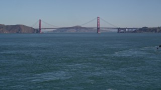 5K aerial stock footage of tilting from the ocean to reveal the famous Golden Gate Bridge, San Francisco, California Aerial Stock Footage | AXSF05_057