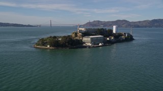 AXSF05_067 - 5K aerial stock footage tilt from low flight over San Francisco Bay, revealing Alcatraz, Golden Gate Bridge, California