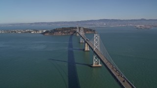 5K aerial stock footage of a view of the Bay Bridge, Yerba Buena Island, Treasure Island in San Francisco, California Aerial Stock Footage | AXSF05_076