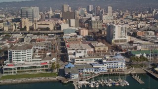 5K aerial stock footage of flying by Jack London Square and office buildings, Oakland, California Aerial Stock Footage | AXSF05_085