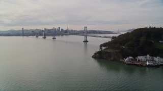 5K aerial stock footage of approaching the Bay Bridge with skyline in the distance, San Francisco, California Aerial Stock Footage | AXSF06_012