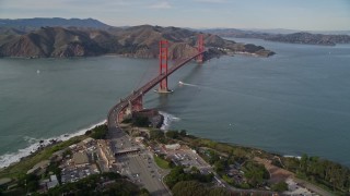 5K aerial stock footage fly over The Presidio and freeway toll booth, reveal Golden Gate Bridge, San Francisco, California Aerial Stock Footage | AXSF06_042