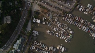 AXSF06_049 - 5K aerial stock footage bird's eye view of a marina on Richardson Bay, Highway 101 freeway and strip mall, Sausalito, California