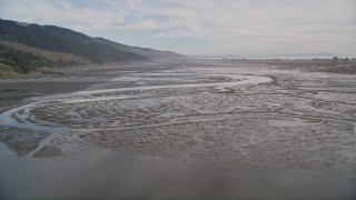 AXSF06_068 - 5K aerial stock footage of flying over the Bolinas Lagoon near marshland, Bolinas, California