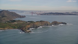 5K aerial stock footage tilt from Marin Headlands revealing Golden Gate Bridge, San Francisco, California Aerial Stock Footage | AXSF06_073