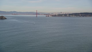 AXSF06_074 - 5K aerial stock footage approach Point Bonita Lighthouse, and fly over to reveal Golden Gate Bridge, San Francisco, California