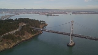 5K aerial stock footage approach the Bay Bridge and tilt to reveal Coast Guard Station on Yerba Buena Island, San Francisco, California Aerial Stock Footage | AXSF06_087