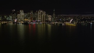 5K aerial stock footage of the city skyline at night seen from the bay, Downtown San Francisco, California, night Aerial Stock Footage | AXSF07_006