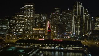 5K aerial stock footage tilt to reveal and ascend over Ferry Building, Downtown San Francisco skyscrapers, and Market Street, California, night Aerial Stock Footage | AXSF07_007