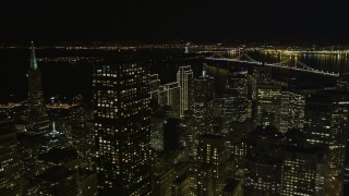 5K aerial stock footage tilt from apartment and office buildings to fly over skyscrapers in Downtown San Francisco, California, night Aerial Stock Footage | AXSF07_013