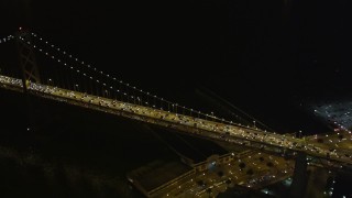 5K aerial stock footage approach and pan across heavy Bay Bridge traffic, Downtown San Francisco, California, night Aerial Stock Footage | AXSF07_027