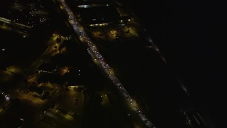 AXSF07_037 - 5K aerial stock footage of a bird's eye of Highway 101 freeway traffic through The Presidio, San Francisco, California, night