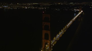 5K aerial stock footage tilt from light traffic to tower of Golden Gate Bridge, San Francisco, California, night Aerial Stock Footage | AXSF07_041