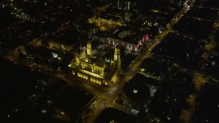 5K aerial stock footage tilt to reveal and orbit St. Ignatius Church in the Inner Richmond District, San Francisco, California, night Aerial Stock Footage | AXSF07_050