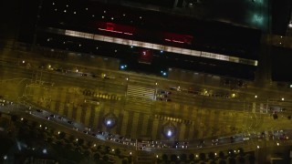 AXSF07_061 - 5K aerial stock footage bird's eye of Market Street, reveal ice skating at Justin Herman Plaza and Ferry Building, Downtown San Francisco, California, night