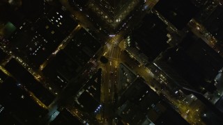 AXSF07_067 - 5K aerial stock footage bird's eye view of Columbus Avenue through North Beach, reveal Transamerica Pyramid and Downtown San Francisco, California, night