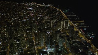 5K aerial stock footage tilt from The Embarcadero to reveal I-80 and Downtown San Francisco, California, night Aerial Stock Footage | AXSF07_076