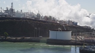 AXSF08_018 - 5K aerial stock footage of flying by the ConocoPhillips Oil Refinery, over the San Pablo Bay, Rodeo, Callifornia