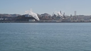 5K aerial stock footage of flying over San Pablo Bay, reveal ConocoPhillips Oil Refinery, Rodeo, California Aerial Stock Footage | AXSF08_021