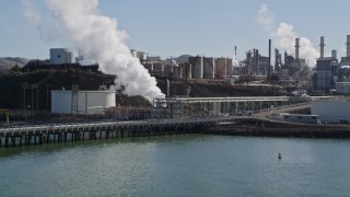 AXSF08_022 - 5K aerial stock footage tilt from San Pablo Bay revealing ConocoPhillips Oil Refinery, Rodeo, California