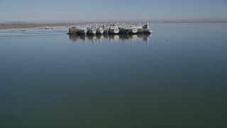 AXSF08_038 - 5K aerial stock footage tilt from Suisun Bay, reveal National Defense Reserve Fleet, California