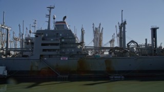 AXSF08_041 - 5K aerial stock footage tilt to reveal National Defense Reserve Fleet warships, Suisun Bay, California