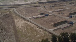 5K aerial stock footage of flying away from the Port Chicago weapons depot, Bay Point, California Aerial Stock Footage | AXSF08_060