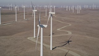 5K aerial stock footage of flying close to a windmill at Shiloh Wind Power Plant, Montezuma Hills, California Aerial Stock Footage | AXSF08_070