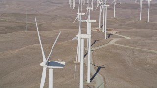 5K aerial stock footage of flying by windmills at Shiloh Wind Power Plant, Montezuma Hills, California Aerial Stock Footage | AXSF08_072