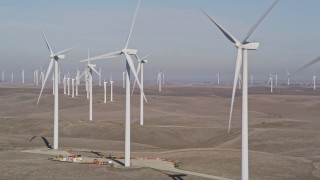 5K aerial stock footage of flying by rows of windmills, Shiloh Wind Power Plant, Montezuma Hills, California Aerial Stock Footage | AXSF08_073