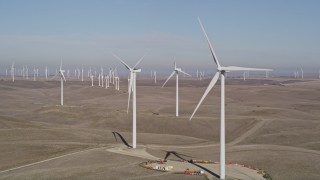 5K aerial stock footage flyby windmills while zooming out at Shiloh Wind Power Plant, Montezuma Hills, California Aerial Stock Footage | AXSF08_078