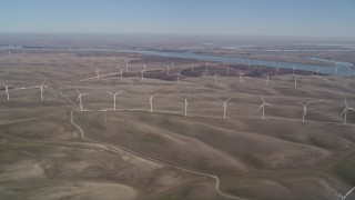 5K aerial stock footage of flying by field of windmills, Shiloh Wind Power Plant, Montezuma Hills, California Aerial Stock Footage | AXSF08_080