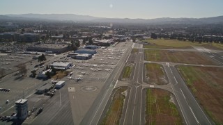 AXSF08_095 - 5K aerial stock footage video approach parked airplanes at Buchanan Field Airport, Concord, California