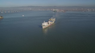 5K aerial stock footage of tracking a cargo ship sailing the San Francisco Bay, San Francisco, California Aerial Stock Footage | AXSF09_057