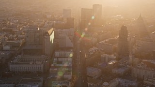 5K aerial stock footage of flying over Market Street through Civic Center, Downtown San Francisco, California at sunset Aerial Stock Footage | AXSF10_017