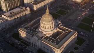 AXSF10_018 - 5K aerial stock footage orbiting San Francisco City Hall, Civic Center, San Francisco, California, sunset