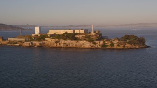 5K aerial stock footage of approaching Alcatraz prison San Francisco, California, sunset Aerial Stock Footage | AXSF10_027