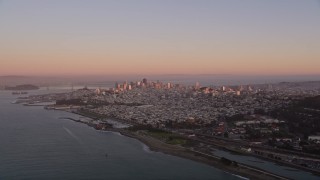 5K aerial stock footage of approaching the Downtown San Francisco skyline at sunset, California Aerial Stock Footage | AXSF10_054