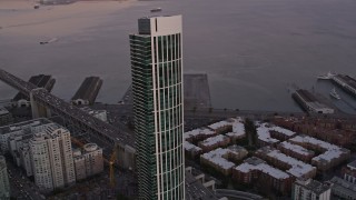 5K aerial stock footage approach and orbit One Rincon Hill skyscraper in South of Market, San Francisco, California, sunset Aerial Stock Footage | AXSF10_060