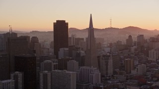 AXSF10_063 - 5K aerial stock footage 555 California Street skyscraper and Transamerica Pyramid, Downtown San Francisco, California, sunset