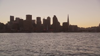 5K aerial stock footage low altitude approach to Ferry Building and Downtown San Francisco skyline, California, twilight Aerial Stock Footage | AXSF10_068