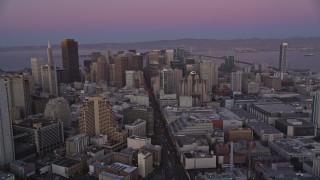 5K aerial stock footage of flying over Market Street through Downtown San Francisco, California, twilight Aerial Stock Footage | AXSF10_075