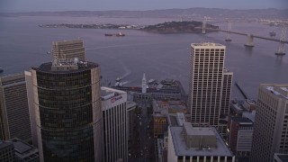 5K aerial stock footage follow Market Street to approach and tilt to Ferry Building, Downtown San Francisco, California, twilight Aerial Stock Footage | AXSF10_078