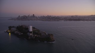 5K aerial stock footage of flying away from downtown, revealing Alcatraz, Downtown San Francisco, California, twilight Aerial Stock Footage | AXSF10_082