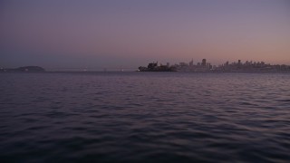 AXSF10_085 - 5K aerial stock footage low altitude approach to Alcatraz, San Francisco, California, twilight