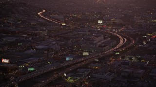 5K aerial stock footage heavy traffic on Interstate 80 by SFPD and County Jail, South of Market, San Francisco, California, twilight Aerial Stock Footage | AXSF10_094