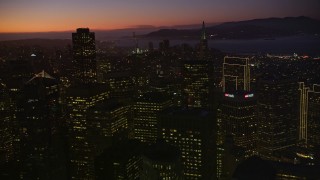 5K aerial stock footage of panning across the city's tall skyscrapers, Downtown San Francisco, California, twilight Aerial Stock Footage | AXSF10_110