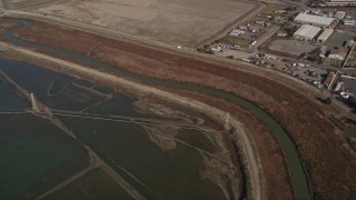 5K aerial stock footage flyby power lines and marshland, reveal water treatment plant, Union City, California Aerial Stock Footage | AXSF11_006